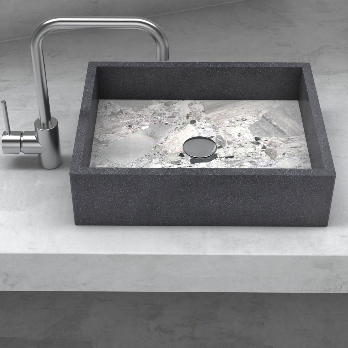 Front view of the Simta rectangular vessel sink with dark granite walls and a veined Carnico marble basin on a stone vanity