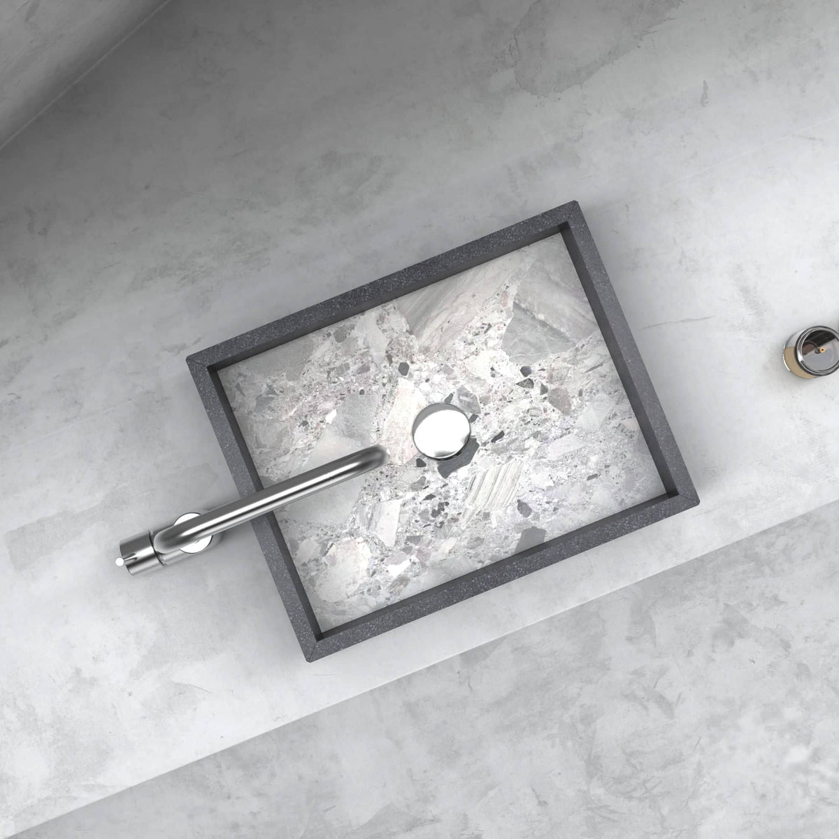 Top view of the Simta rectangular sink showing its veined marble basin and round drain