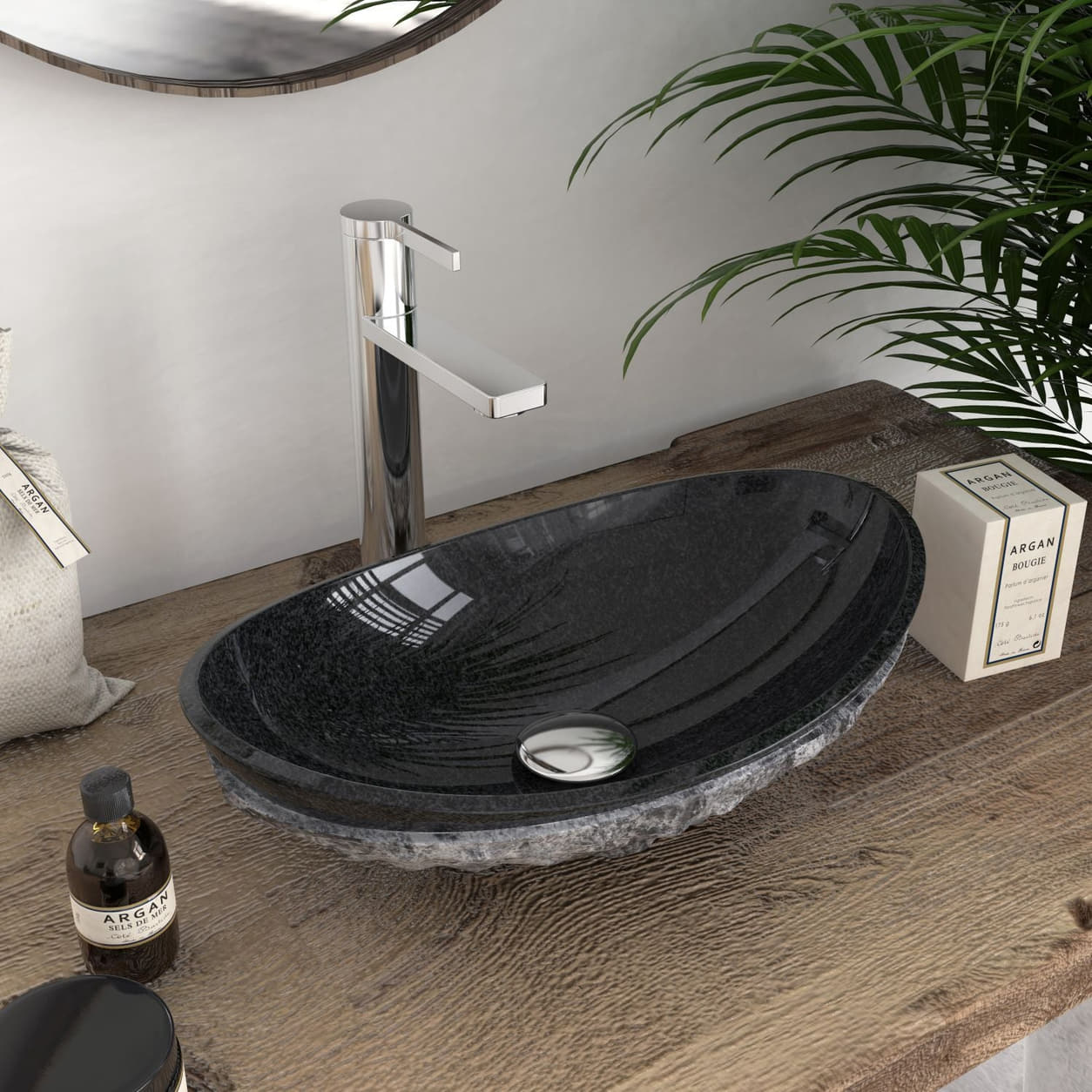 Angled close view of the Soraya oval stone sink showing its dark polished basin and drain