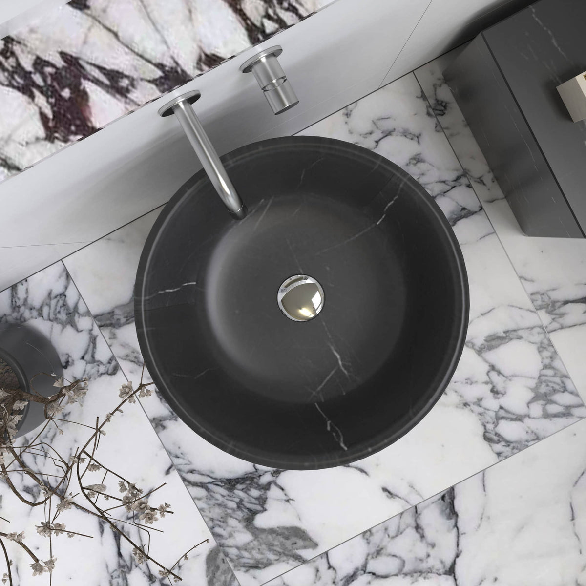 Top view of the Pamala black Portoro marble sink showing the circular bowl and drain