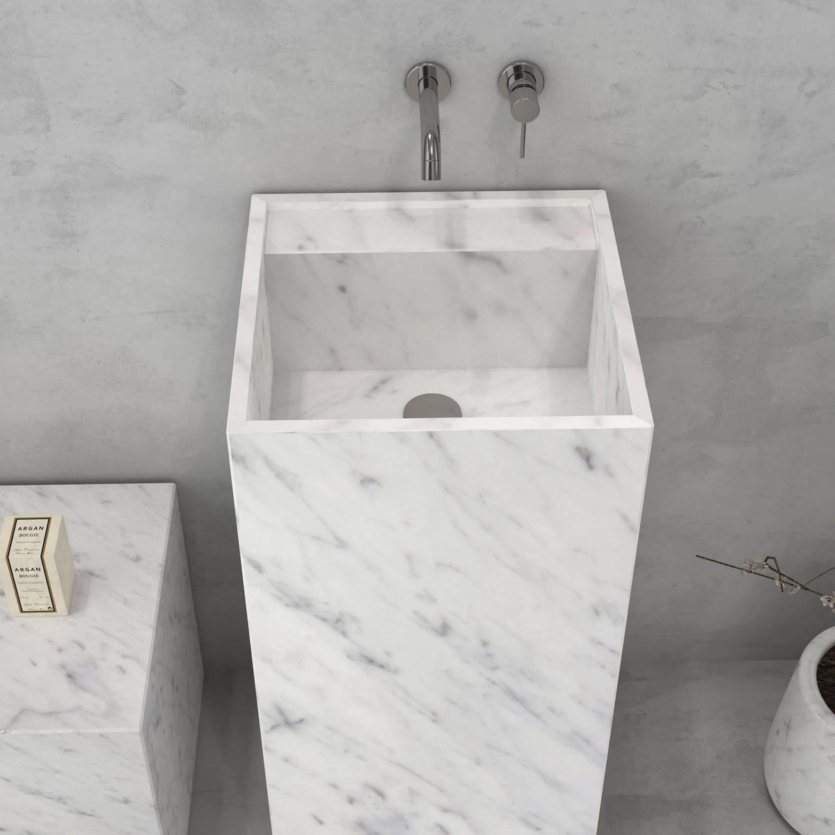 Elevated front view of the Panini Carrara marble pedestal sink showing its square basin