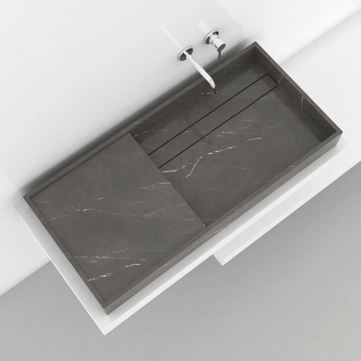 Overhead view of the Tavira grey marble basin showing the recessed sink and adjacent stone surface