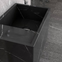 Close-up of the Tilika Portoro marble sink showing its basin and veined front