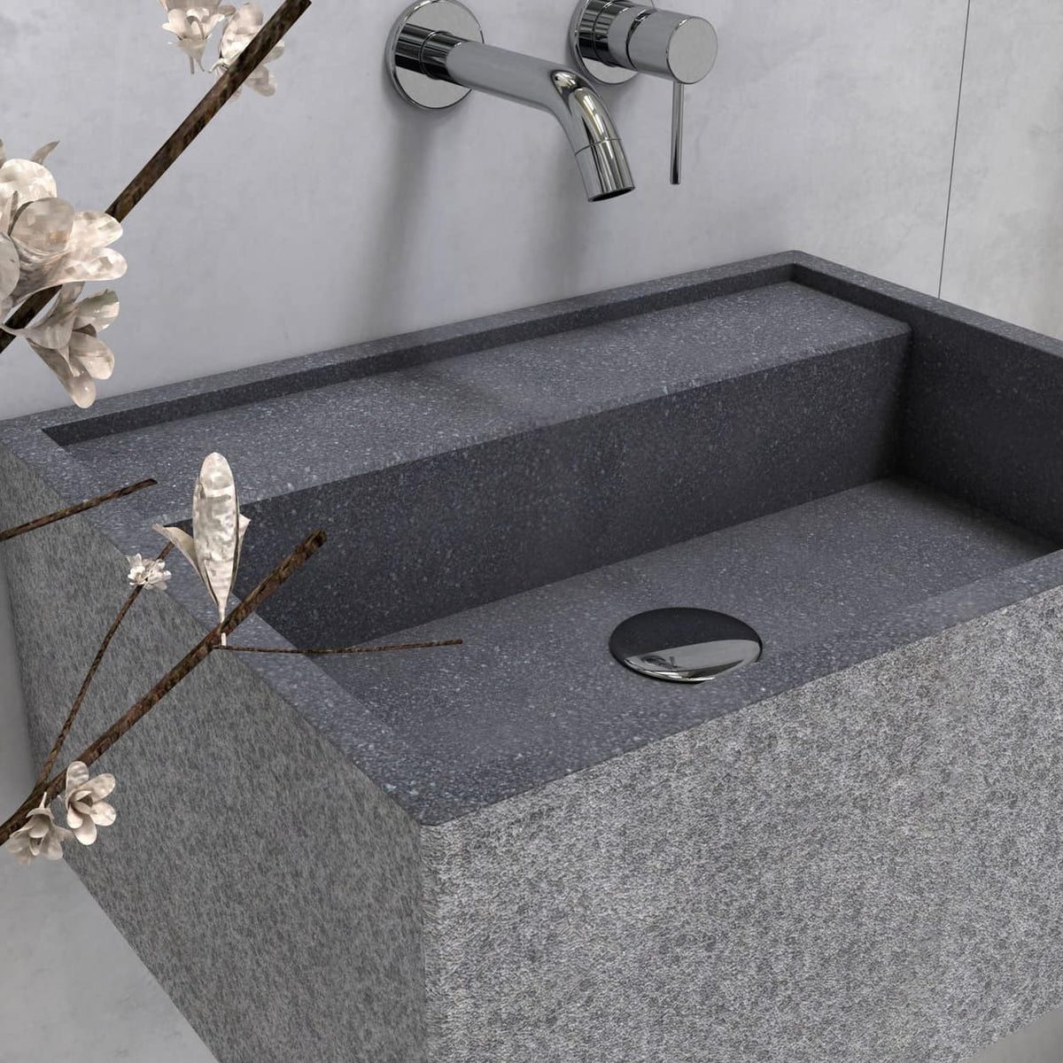 Close-up of the Tibna Neroco stone basin rim and drain