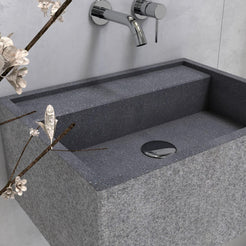 Close-up of the Tibna Neroco stone basin rim and drain