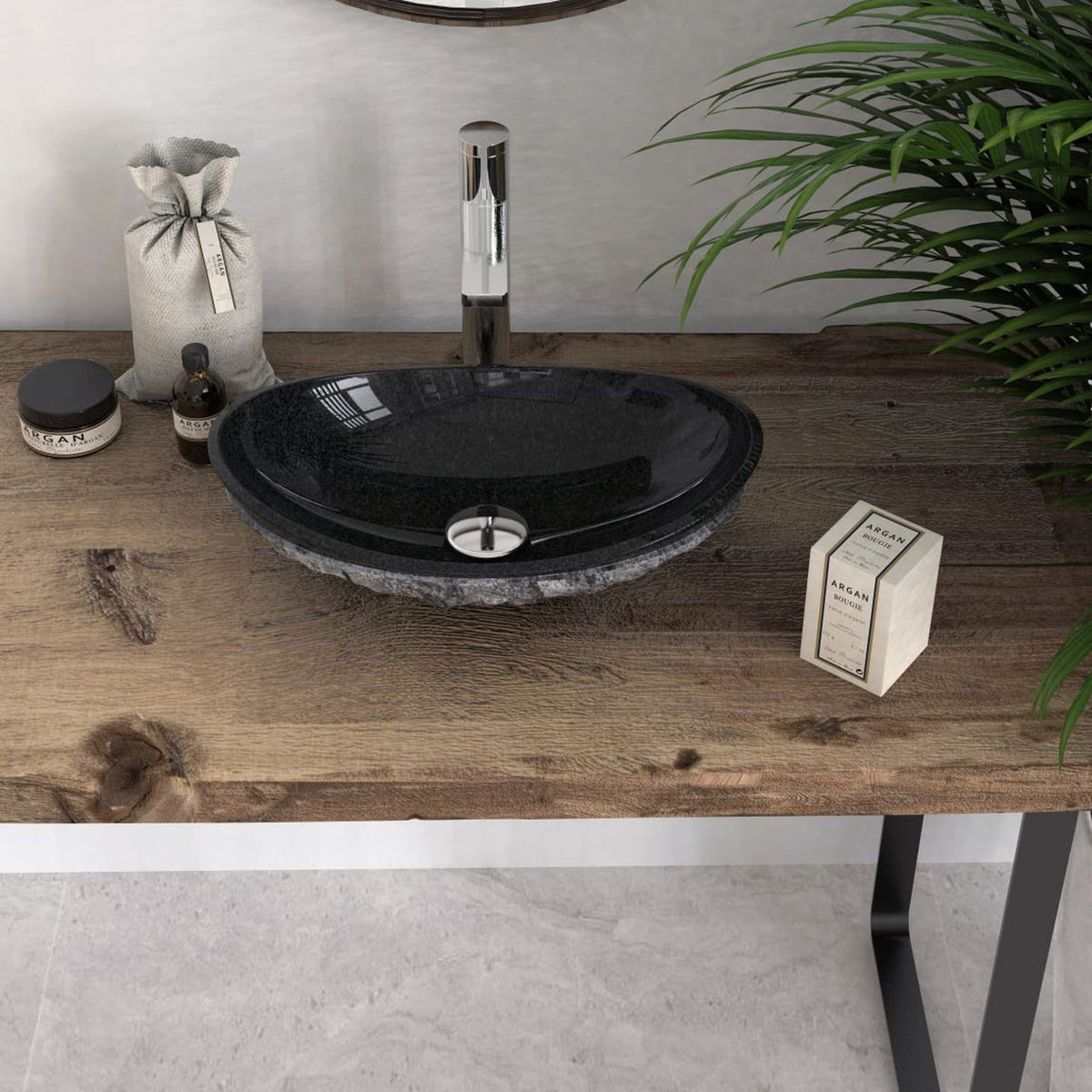 Front angled lifestyle view of the Soraya oval Neroco stone sink on a wooden vanity with its polished dark interior
