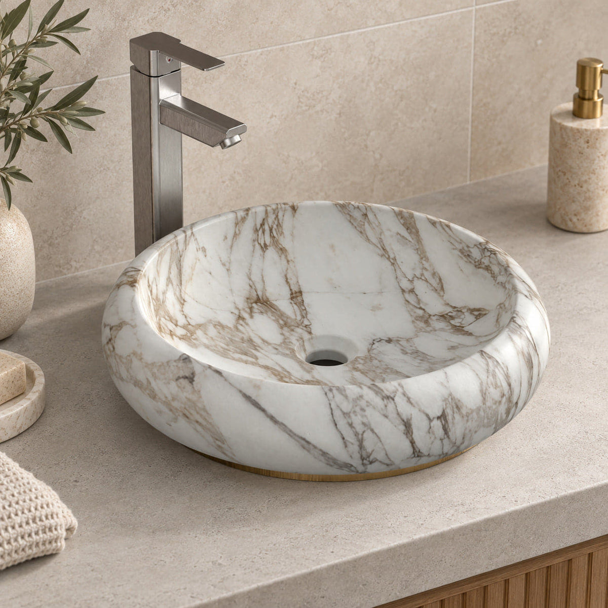 Illustrative higher-angle countertop setting showing Sabino Terista marble veining and round drain opening