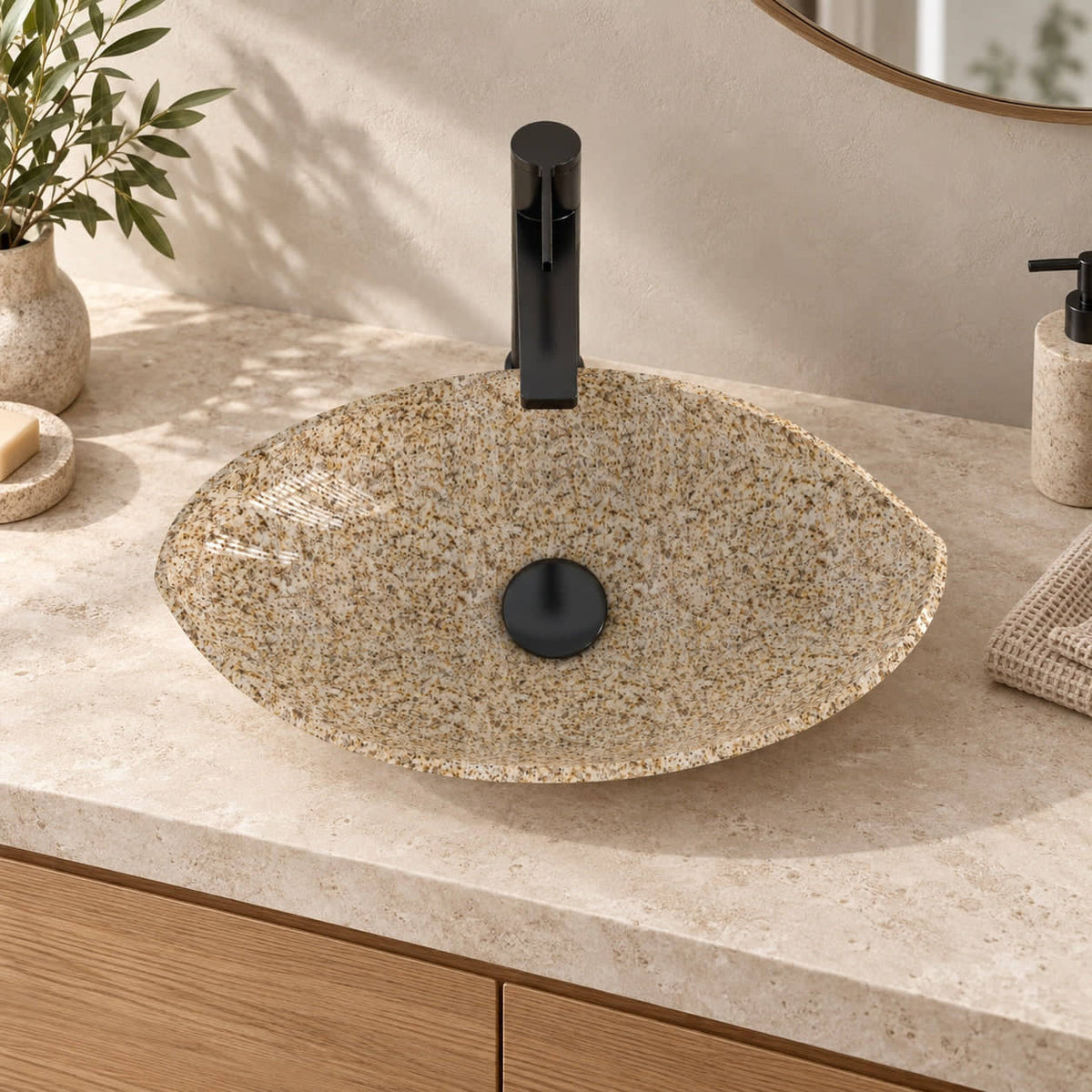 Sikota Sicilia Stone Vessel Sink, centered basin on a warm stone countertop in a bathroom setting