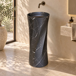 Polita Portoro Black Marble Pedestal Sink — complete pedestal sink in a warm plaster bathroom