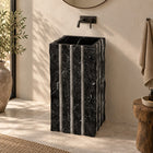 Pablo Portoro Black Marble Pedestal Sink — complete rectangular pedestal with vertical details in a warm bathroom