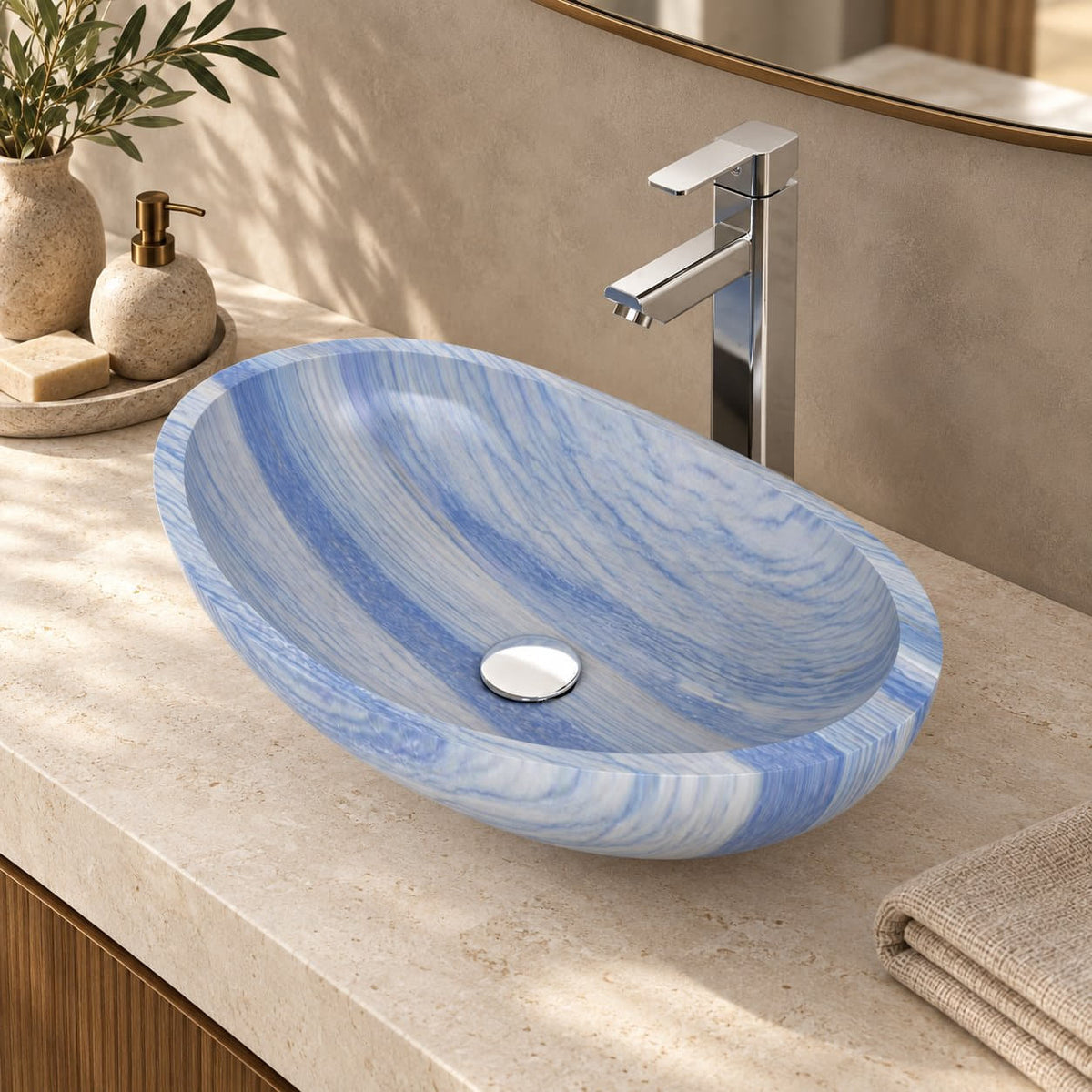 Elevated bathroom view of the Spirit Azura oval quartzite vessel sink showing blue-white mineral bands and its circular drain cover
