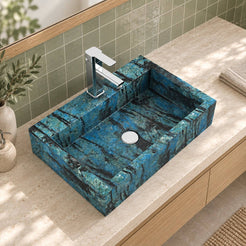 Elevated bathroom view of the Shafna Danube quartzite sink showing its rectangular basin, rear faucet deck and circular drain