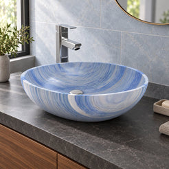 Shabin Azura oval blue quartzite vessel sink on a charcoal counter showing its curved profile and blue-white bands
