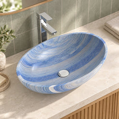 Elevated bathroom view of the Shabin Azura quartzite vessel sink showing the oval rim, inner basin and round drain