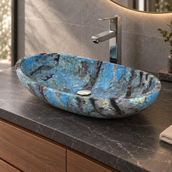 Spirit Danube oval blue quartzite vessel sink on a charcoal counter showing its low curved profile