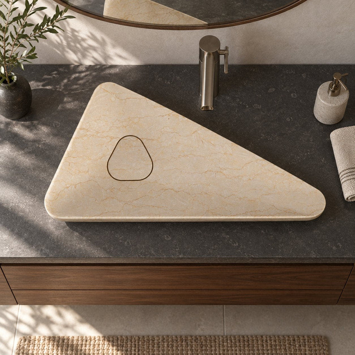 Illustrative overhead bathroom vanity setting showing the Sabala asymmetric triangular Crema marble basin