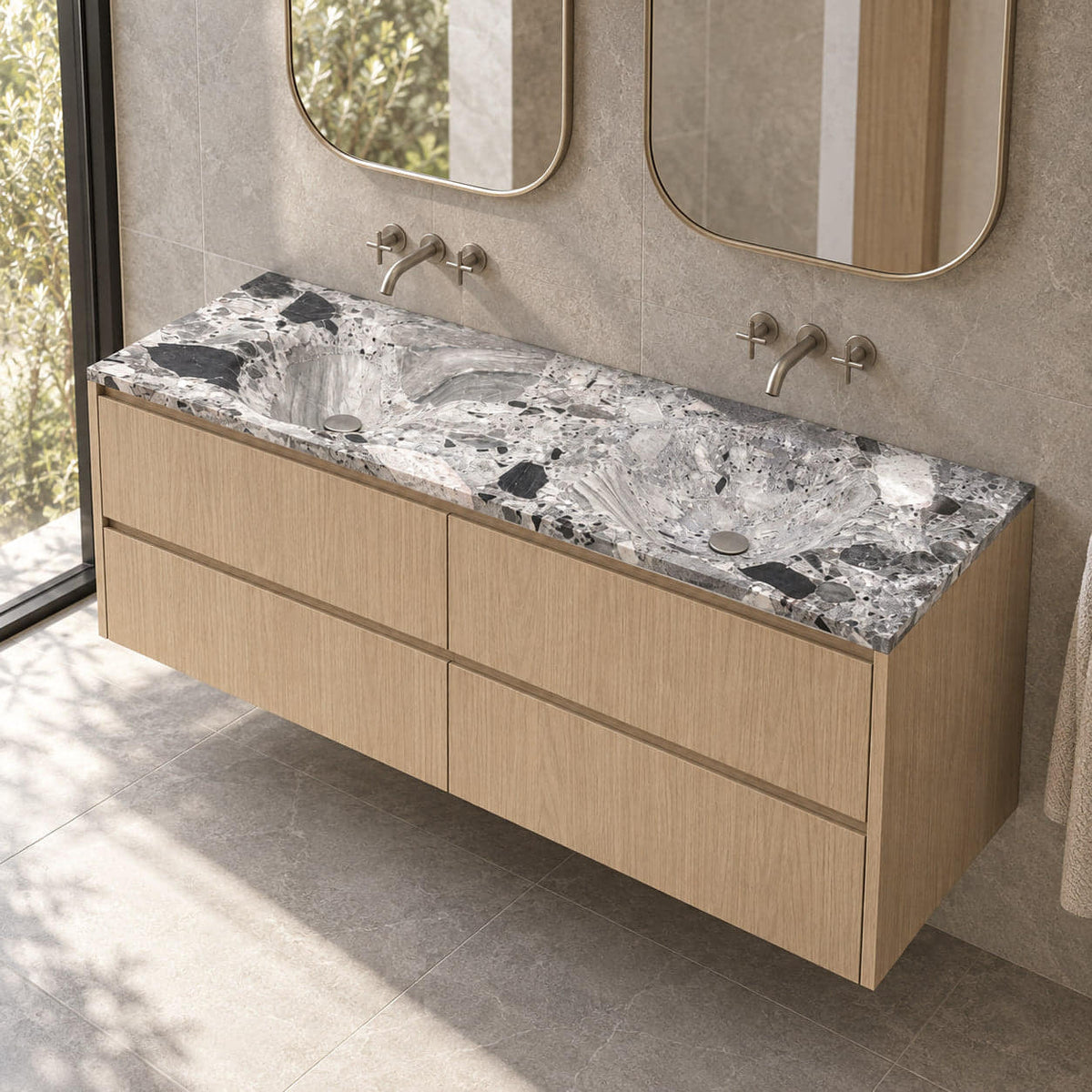 Taimi Carnico Marble Integrated Basin on an oak vanity in a stone-tiled bathroom, showing both sculpted basins and thin stone edge