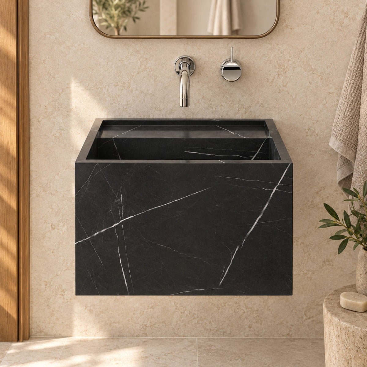 Front view of Tilika Portoro marble wall-mounted sink in an ivory limestone and oak bathroom, showing its complete tall rectangular floating profile