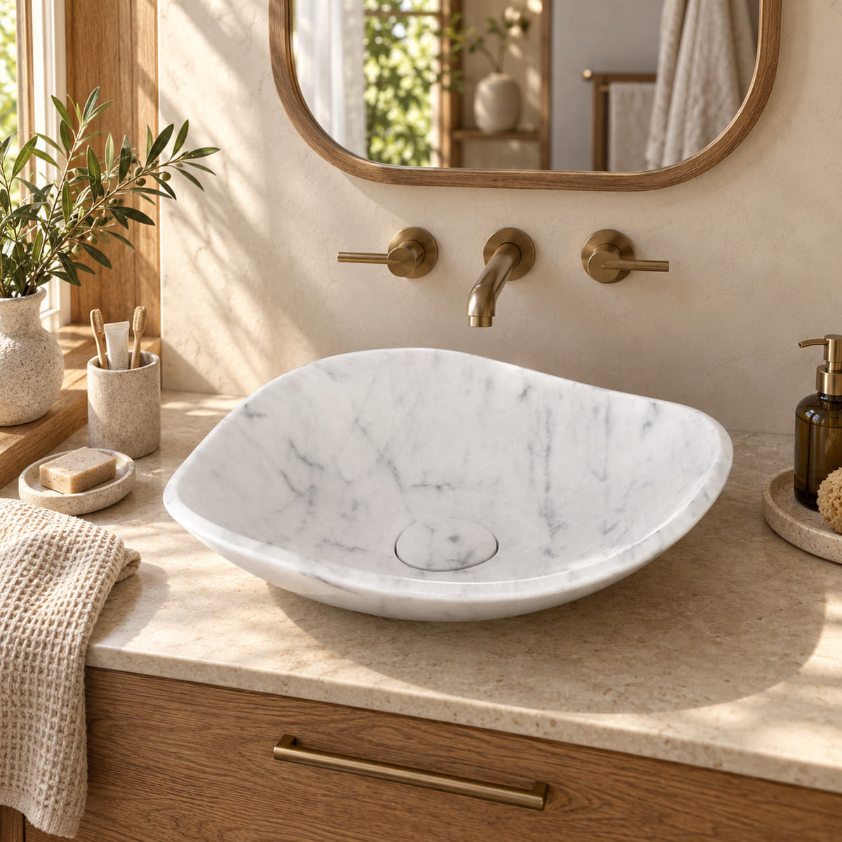 Sita Carrara Marble vessel sink beside a warm oak bathroom window