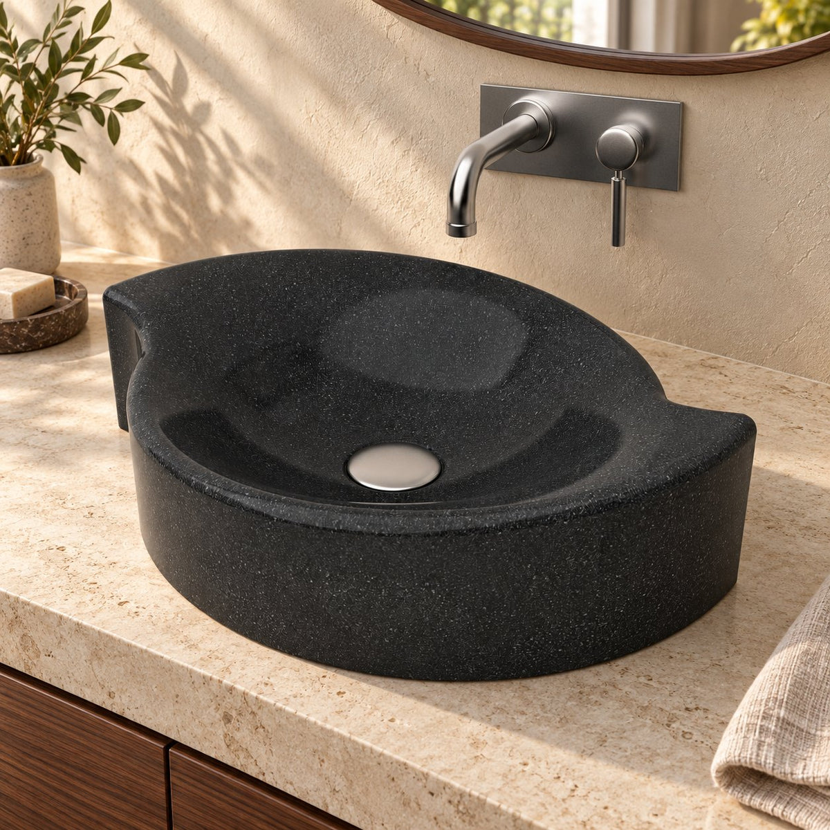 Illustrative three-quarter bathroom lifestyle of the Sommer Neroco stone vessel sink with its sculpted rim