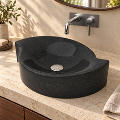 Illustrative three-quarter bathroom lifestyle of the Sommer Neroco stone vessel sink with its sculpted rim