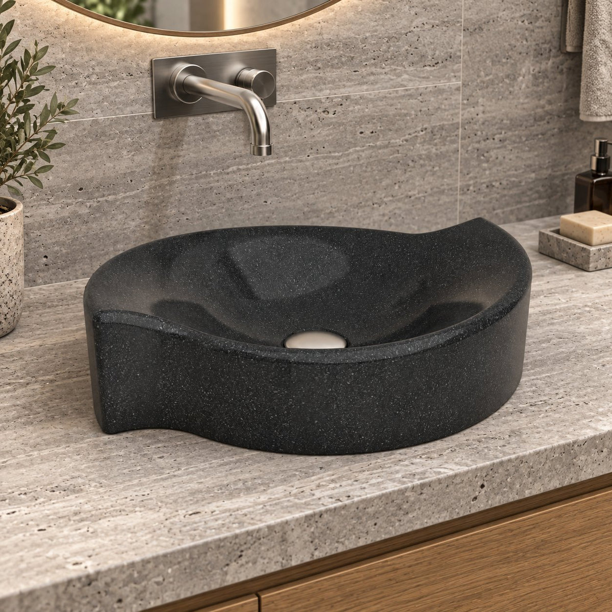 Illustrative opposite-side bathroom lifestyle of the Sommer Neroco stone vessel sink with its sculpted rim
