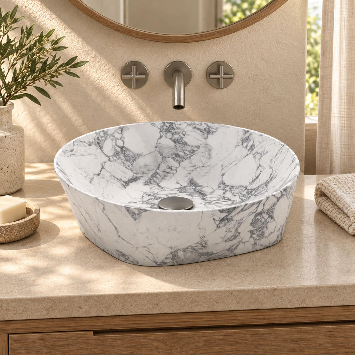 Sonaly Arabescato vessel sink in a warm ivory and oak bathroom