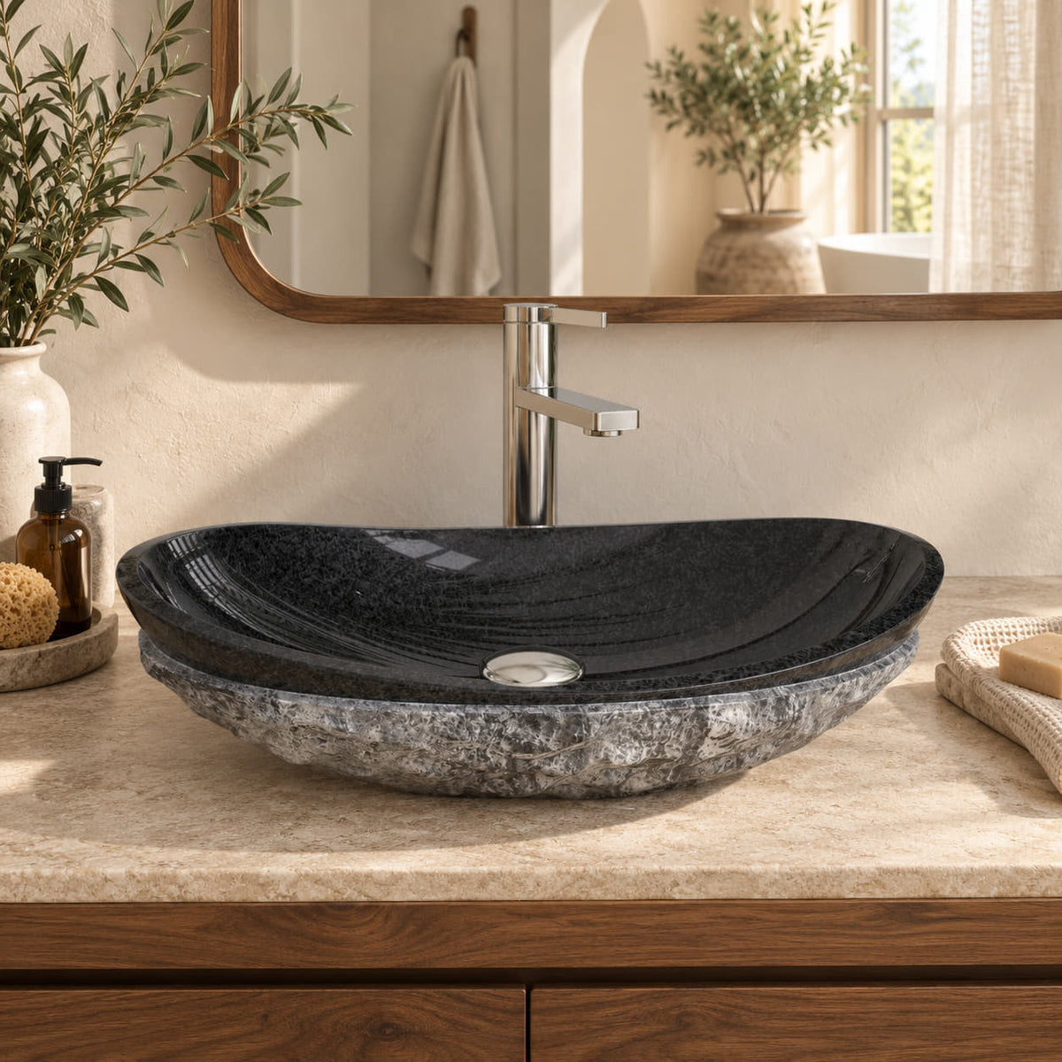 Soraya Oval Neroco Stone vessel sink from the front in a warm walnut bathroom, showing its polished black basin and rough gray exterior.