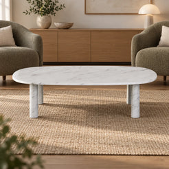 SquareCurve Carrara marble coffee table shown from a low long-side angle in a conversation lounge.