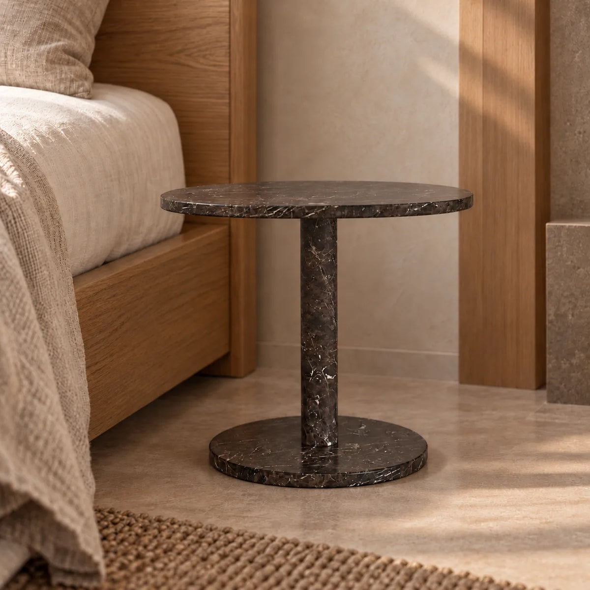 Low frontal view of the SquareSoft Dark Emperador marble side table beside a timber bed.
