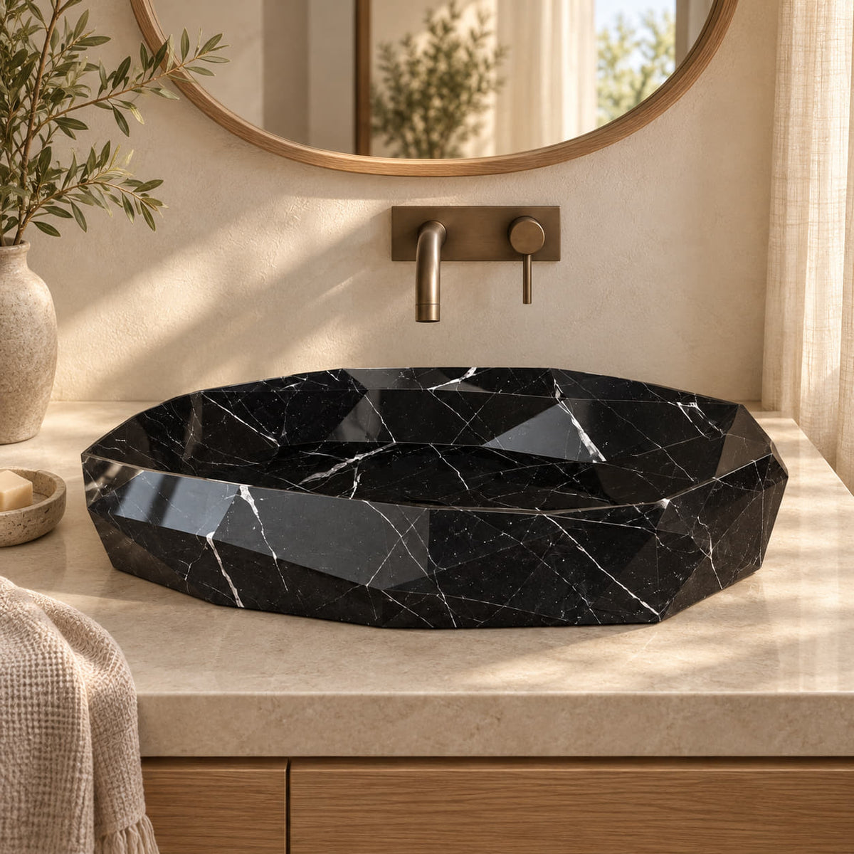 Sreya Portoro Marble faceted vessel sink from the front in a warm ivory bathroom, with angular stone planes and a matching polygonal drain cover.