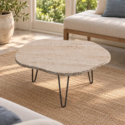 Elevated view of the StoneMist travertine coffee table in a garden-facing sunroom.