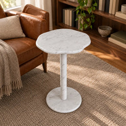SunAura Carrara marble side table in a warm reading corner, shown from a high front view