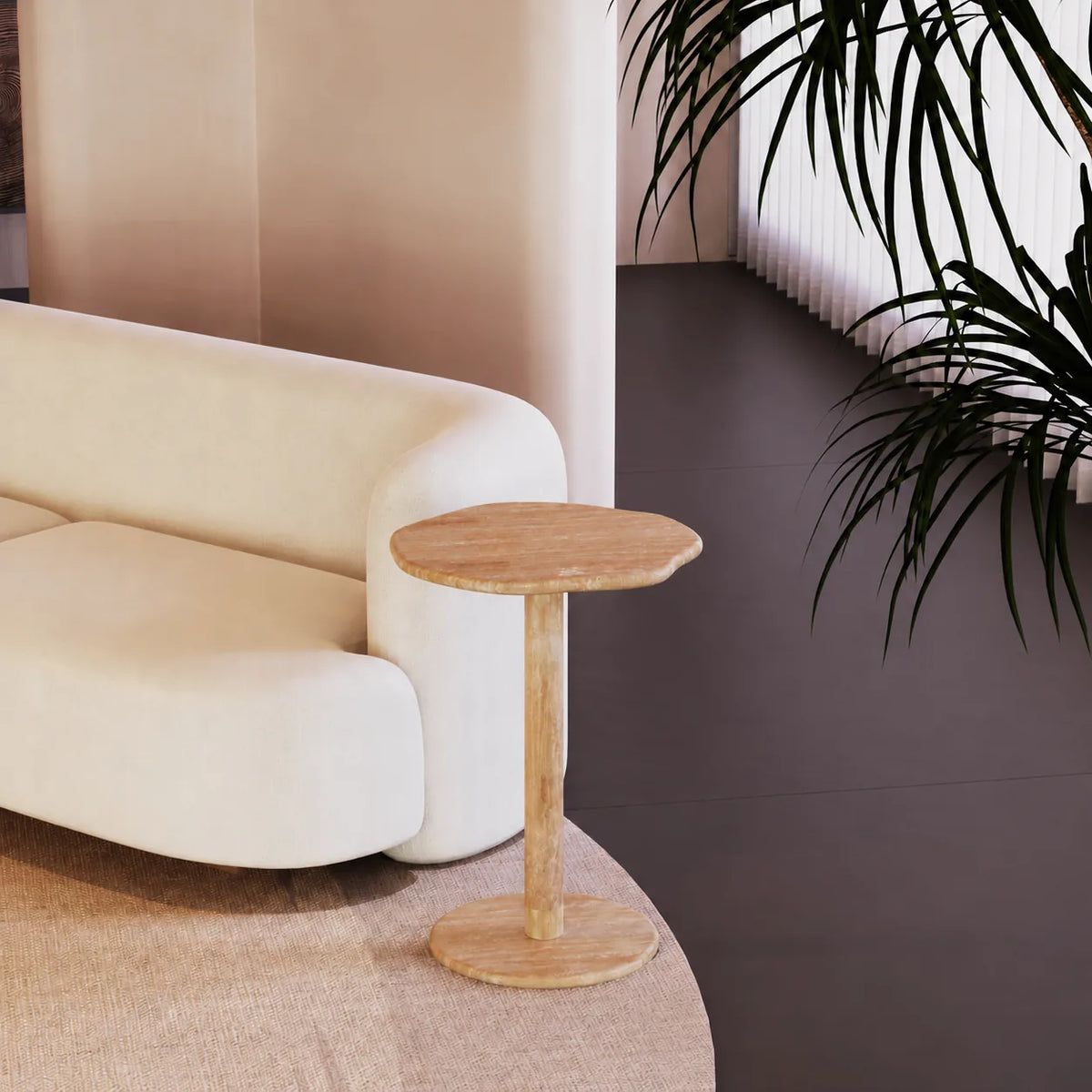 SunAura Italian Classico travertine Standard side table beside a cream sofa, shown from a moderate front-quarter view
