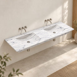 Taiya Carrara White Marble Wall-Mounted Sink — complete double basin in a warm bathroom, three-quarter view