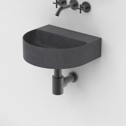 Tibota Neroco Granite Wall-Mounted Sink — three-quarter bathroom view showing the complete basin