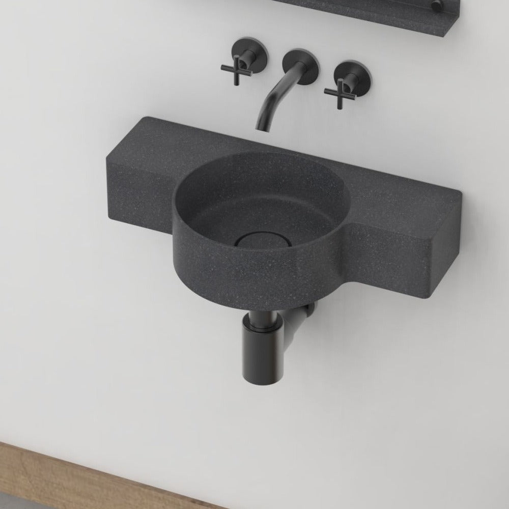 Tilda Neroco Granite Wall-Mounted Sink — three-quarter bathroom view showing the complete basin