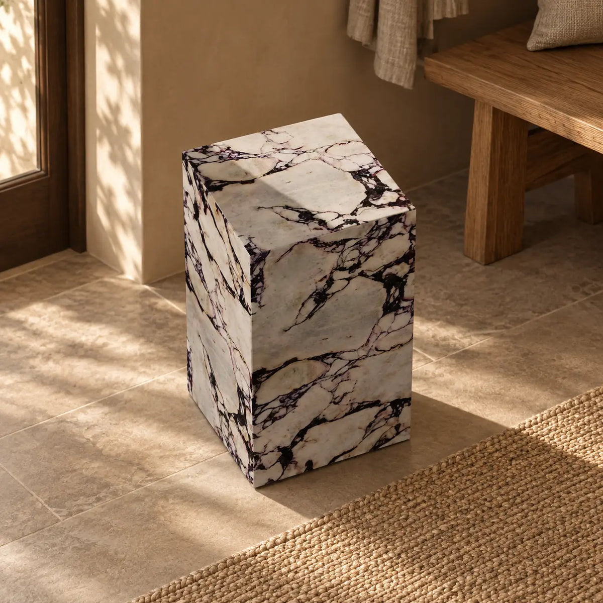 ViolaPlinth Calacatta Viola marble side table in a warm entry hall, shown from a high front-quarter view