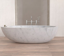 Yaris BT-121A Carrara White Marble bathtub, original product reference view; source photograph reframed without changing the stone, rim or silhouette